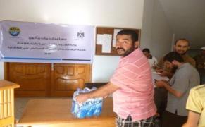 توزيع مساعدات لمدينة الزهراء خلال العدوان الاسرائيلي لعام 2014م